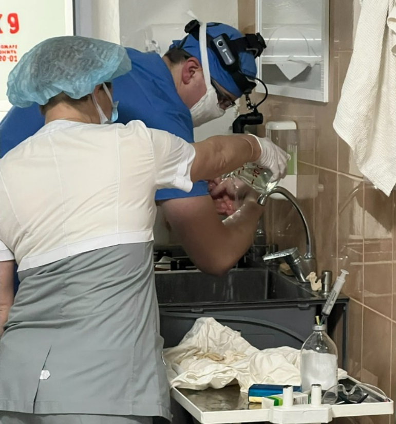 Mike scrubbing in Ukraine doctor